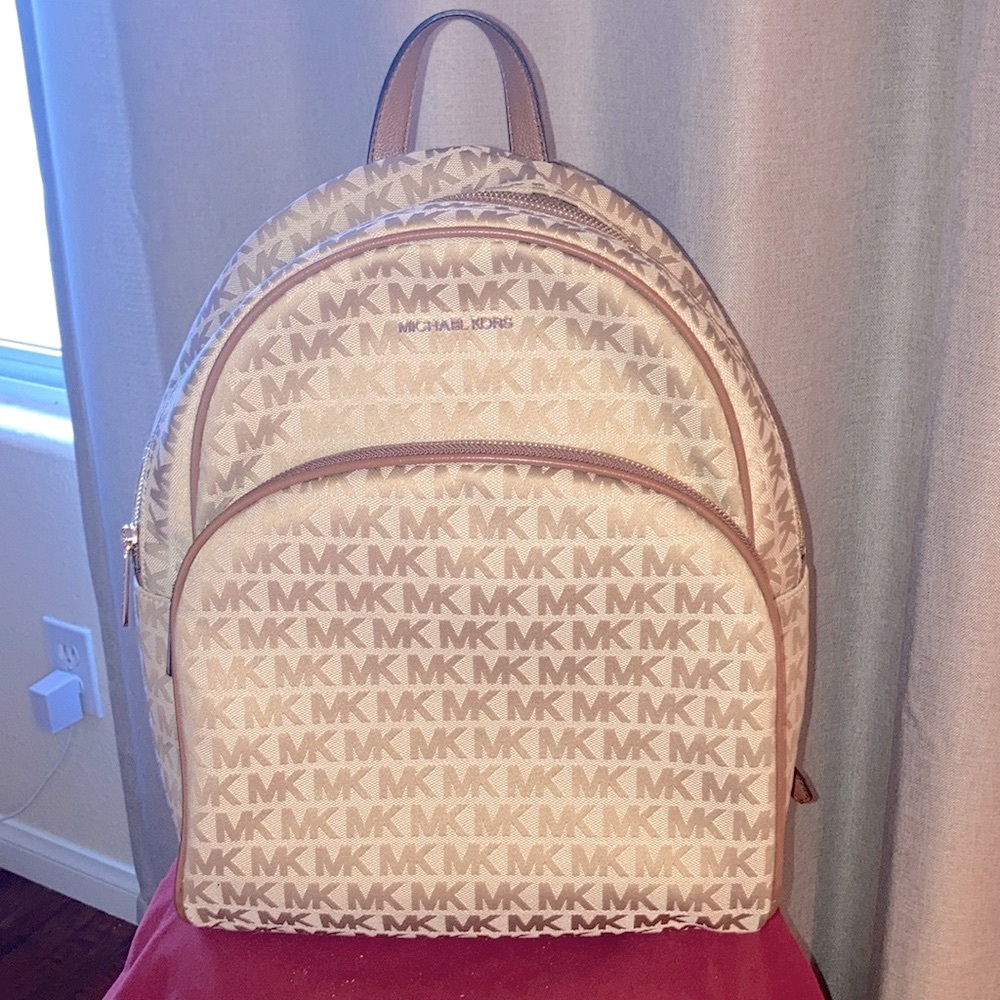 NWOT” Michael Kors Lg Pack Vibrant Gold with brown leather straps,